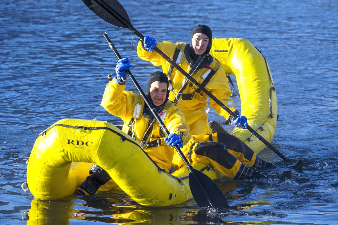 Air Force fire protection specialists use an inflatable raft to recover a simulated cold water victim while conducting ice water rescue training at Joint Base Elmendorf-Richardson, Alaska, Feb. 4, 2017. Air Force photo by Alejandro Pena