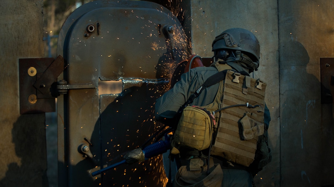 A U.S. Marine attending the Methods of Entry (MOE) course, uses a torch to cut through steel during a practical application exercise at Marine Corps Base Quantico, Virginia, Jan. 25, 2017. MOE teaches Marines advanced level skills on how to properly and effectively gain entry into buildings, structures and ships.