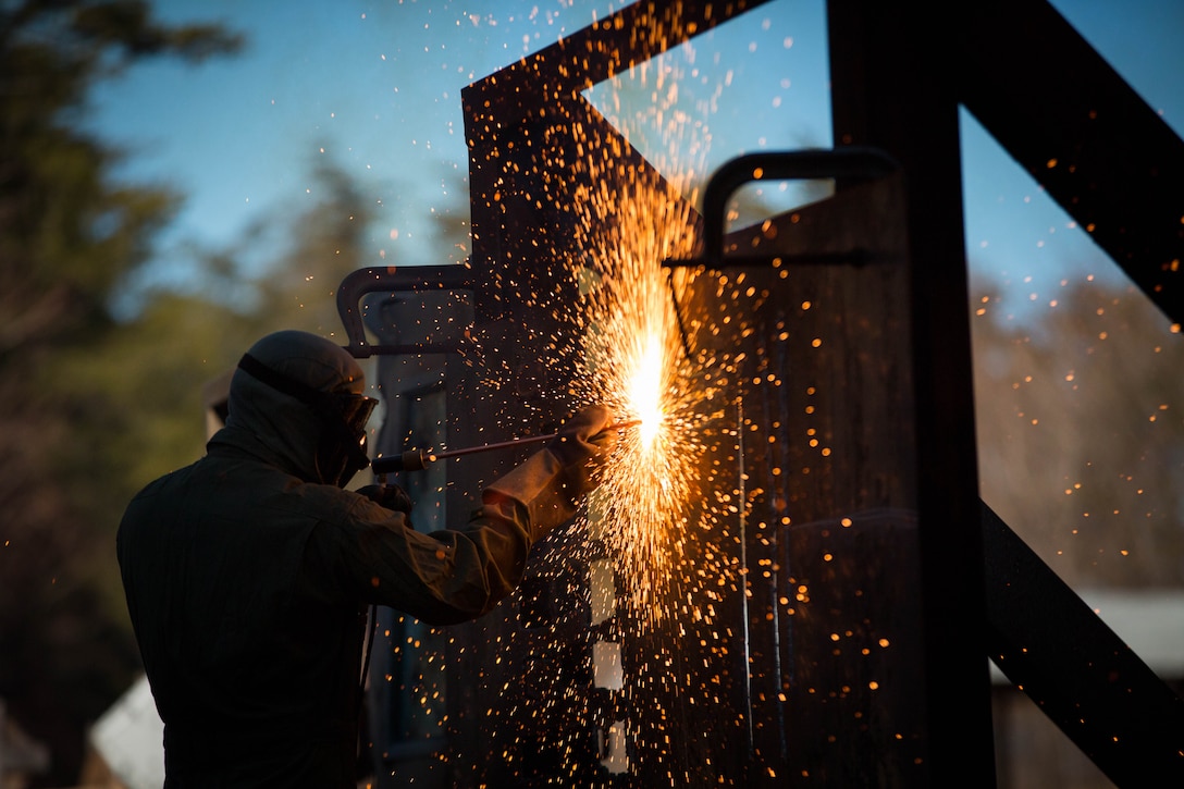 A U.S. Marine attending the Methods of Entry (MOE) course, uses a torch to cut through steel during a practical application exercise at Marine Corps Base Quantico, Virginia, Jan. 25, 2017. MOE teaches Marines advanced level skills on how to properly and effectively gain entry into buildings, structures and ships. 