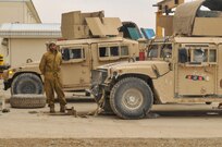 A mechanic from the 215th Corps fixes military vehicles during a visit of U.S. and Afghan high ranking officers. The visitors toured the 215th Corps' logistics warehouses in Helmand to assess logistical challenges and evaluate next steps to build capacity and sustainment progression for Operation Shafaq II Campaign.

The 215th Corps, composed of three brigades of almost twelve thousand soldiers is stationed in Helmand, one of the most hotly-contested provinces in the country.(U.S. Navy photo by Lt. j.g. Egdanis Torres Sierra, Combined Security Transition Command CSTC–A Public Affairs)