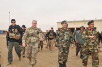 Maj. Gen. Richard G. Kaiser, commanding general of Combined Security Transition Command-Afghanistan, tours the logistics warehouses of the 215th Corps in Helmand in February, 2017, to assess logistical challenges and evaluate next steps to build capacity and sustainment progression for Operation Shafaq II Campaign. Accompanying him was Afghan Maj. Gen. Ahmadzai Sakhi, assistant director of the Ministry of Defense for technology, acquisition and logistics.



"Our visit to the 215th Corps was to observe the Operation Shafaq II campaign sustainment progression by senior leadership from MoD and to personally evaluate critical areas where Combined Security Transition Command- Afghanistan can provide support," said Maj. Gen. Richard G. Kaiser, commanding general of CSTC-A. (U.S. Navy photo by Lt. j.g. Egdanis Torres Sierra, Combined Security Transition Command CSTC–A Public Affairs)