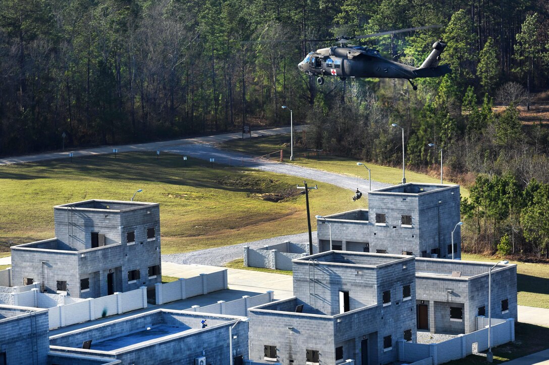 An Army National Guard soldier is hoisted up to a UH-60 Black Hawk helicopter during Patriot South Exercise 2017 at the Gulfport and Port Bienville Industrial Complex, Mississippi, Jan. 31, 2017. Army National Guard photo by Staff Sgt. Roberto Di Giovine