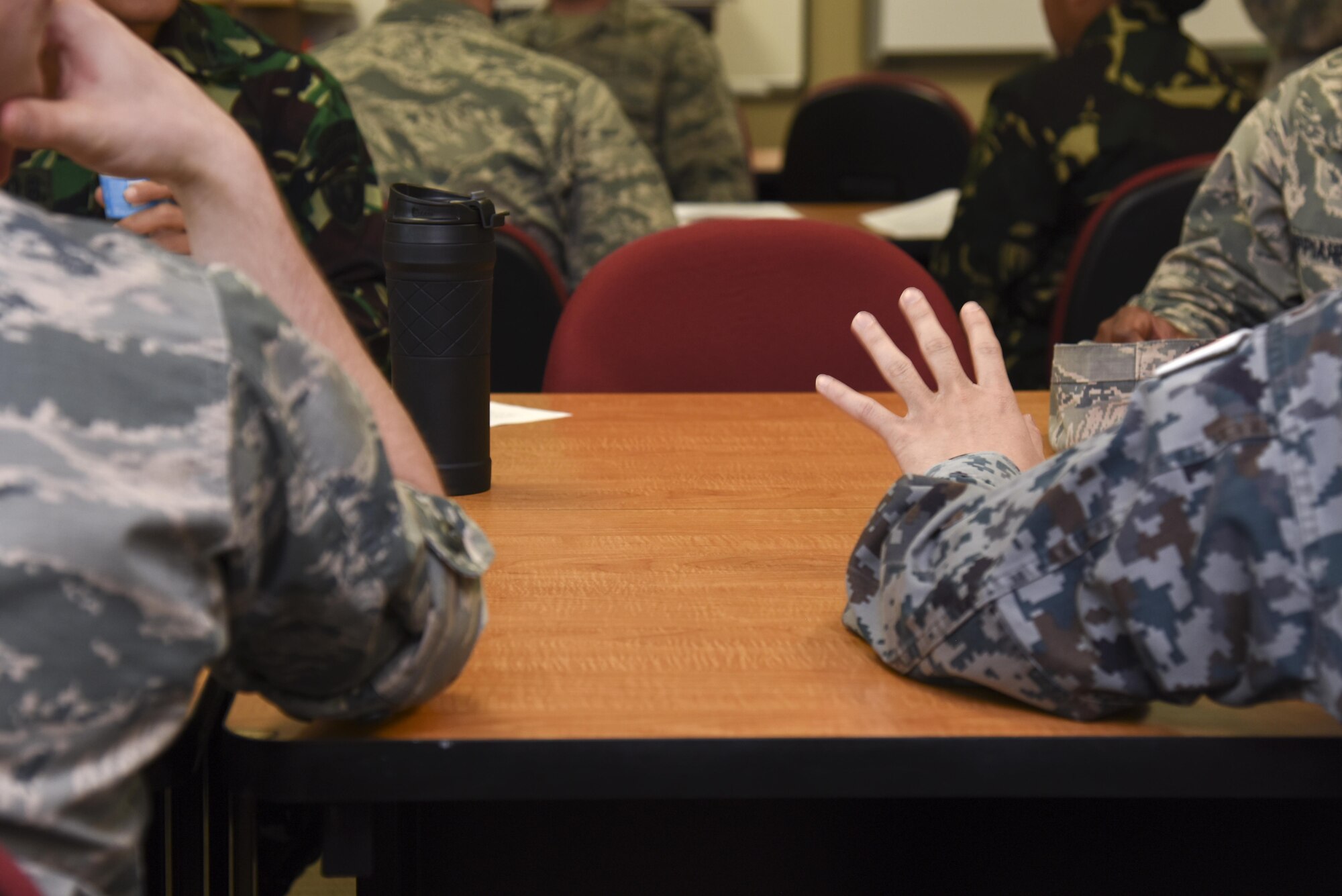 315th Training Squadron intelligence students work alongside international military students during a joint exercise at the Consolidated Learning Center on Goodfellow Air Force Base, Texas, Feb. 7, 2017. The exercise focused on using classified information gathering to locate a person. (U.S. Air Force photo by Staff Sgt. Joshua Edwards/Released)