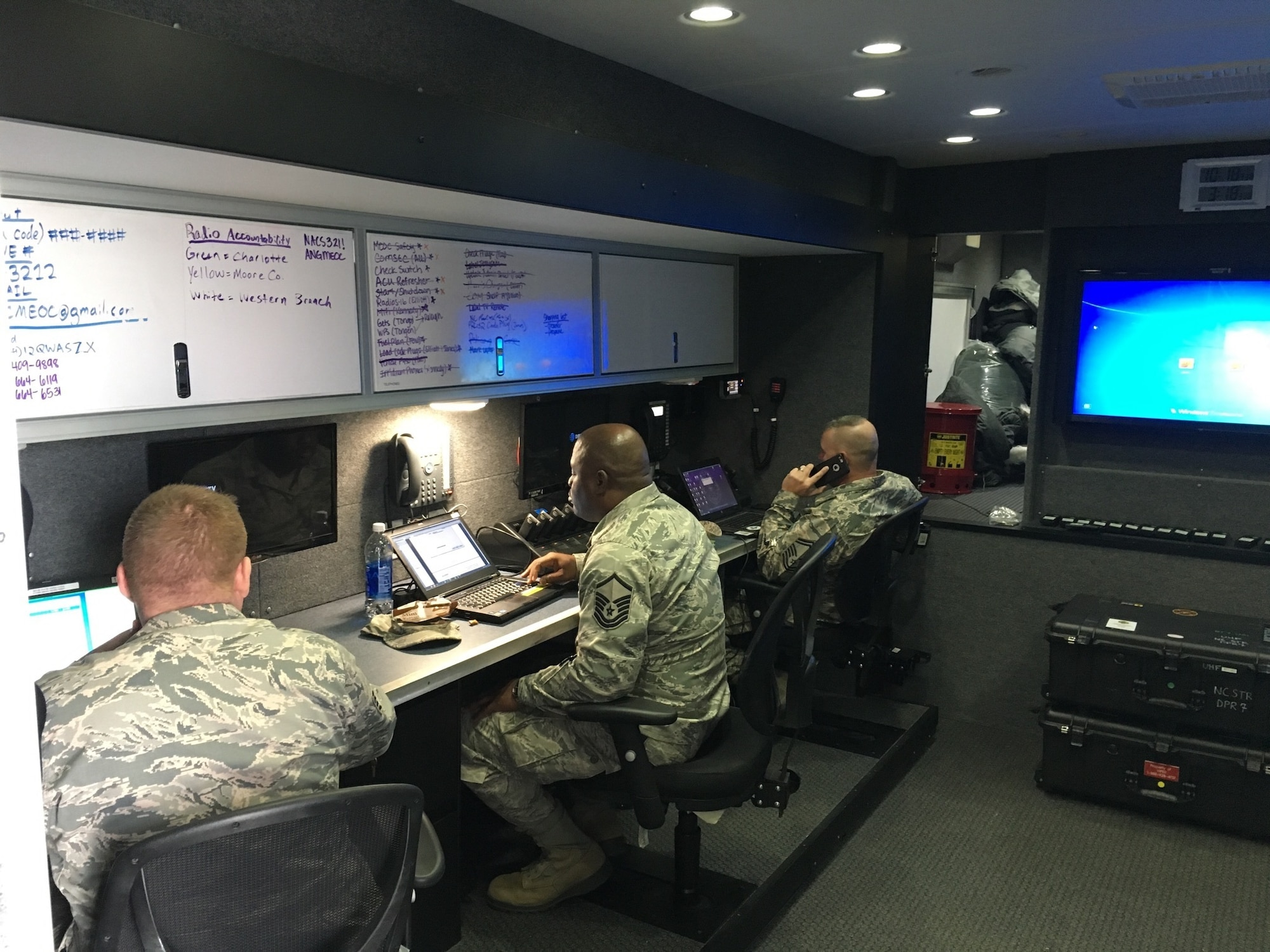 The North Carolina Air National Guard Mobile Emergency Operations Center (MEOC) team works diligently to provide backup communications to three tactical operations centers Task Force Security, Task Force Crowd, and Task Force Access, in Washington D.C., Jan. 19, 2017. The team consists of National Guard Airmen Master Sg.t Rebecca Tongen, Staff Sgt. Mark Fow, Senior Master Sgt. James Cutshaw, Master Sgt. Timothy Jones, Staff Sergeant Benjamin Elliot, Brigadier Gen. Staudenraus, and Master Sgt. Erik Kennedy. About 8000 soldiers and airmen are tasked to support the 58th United States presidential inauguration on Jan. 20, 2017. (U.S. Air National Guard photo credited to Master Sgt. Rebecca S. Tongen)