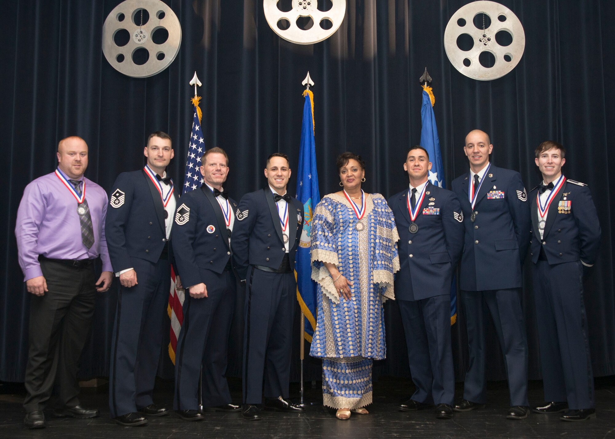 The 2016 436th Airlift Wing Annual Award winners pose for a group photo following the 2016 Annual Awards Ceremony Feb. 3, 2017, at the Rollins Center inside of Dover Downs, Dover, Del. This year’s ceremony theme was “A night with the Stars.”(U.S. Air Force photo by Staff Sgt. Jared Duhon)