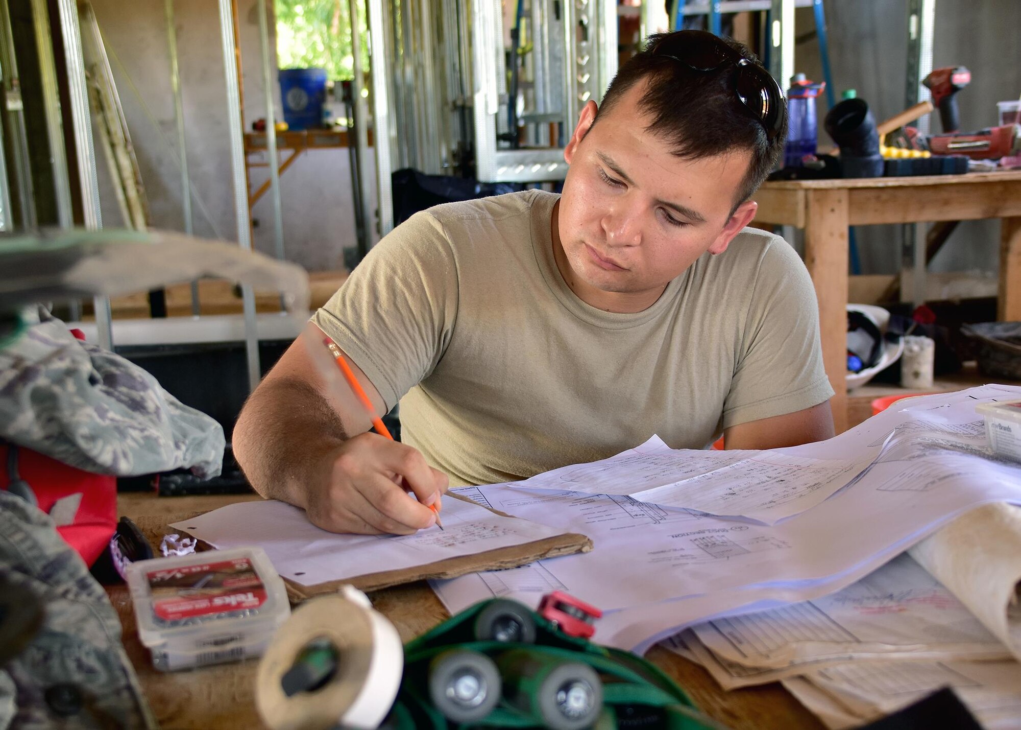 Staff Sgt. John Irving from the 143d Civil Engineering Squadron (CES), Rhode Island Air National Guard rinse creates a material list for electrical work in Inarajan, Guam during an Innovative Readiness Training (IRT) project on September 5, 2016.  The IRT project, in conjunction with Habitat for Humanity Guam is to provide two homes for residents in Inarajan.  The members are part of a 36 Airmen crew from a cross section of trades within the CES.  U.S. Air National Guard photo by Master Sgt. John V. McDonald
