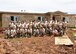 Members of the 143d Civil Engineering Squadron and Public Affairs pose with members of the Guam Innovative Readiness Training Support Team and members of the family chosen by Habitat for Humanity, Guam to receive one of the houses being built. The 143 CES and PA teams are in Guam supporting Habitat for Humanity, Guam through the Innovative Readiness Training program building two houses for deserving local families. Air National Guard photo by Master Sgt Janeen Miller