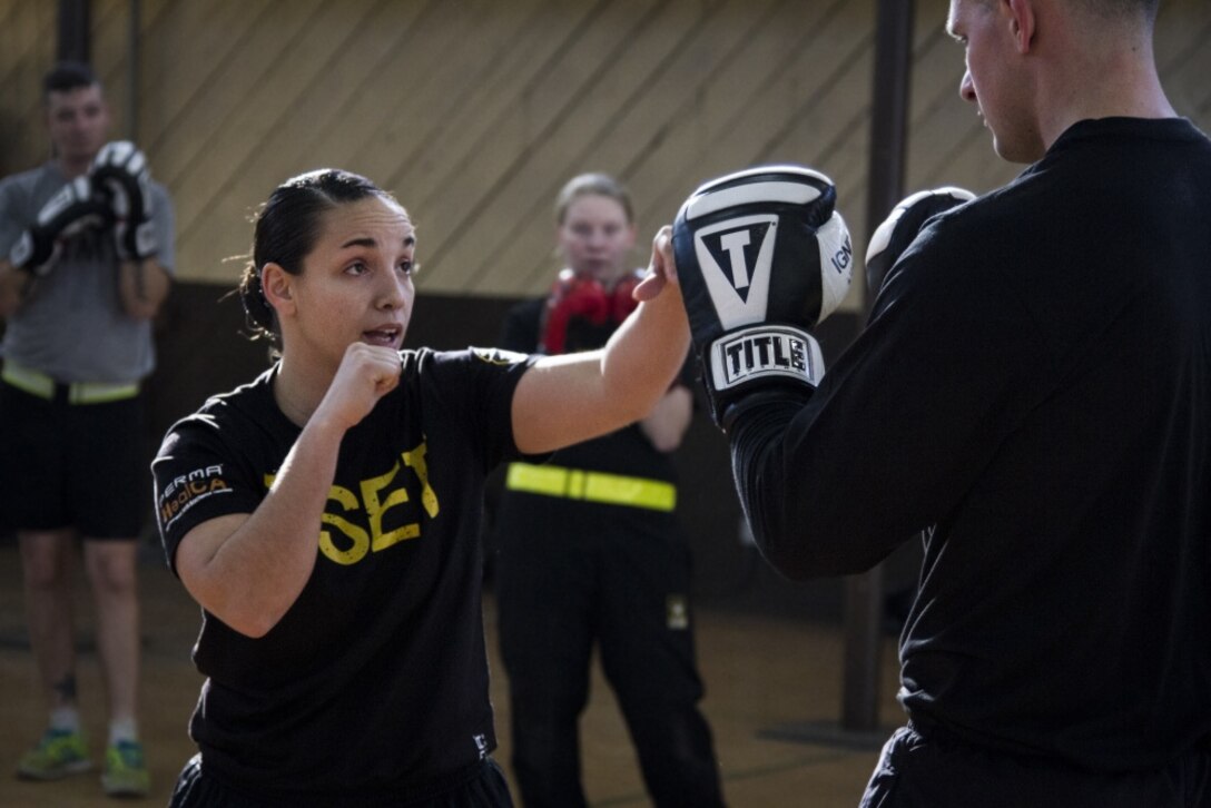 JOINT FORCES TRAINING BASE LOS ALAMITOS, Calif. (January 26, 2017) - Sgt. Alexandria Love, a national boxing champion from the Army's World Class Athlete Program, taught participants in the Guardian Fit Camp different boxing exercises as an alternative cardio workout.

(U.S. Army Photo by Cpl. Timothy Yao)
