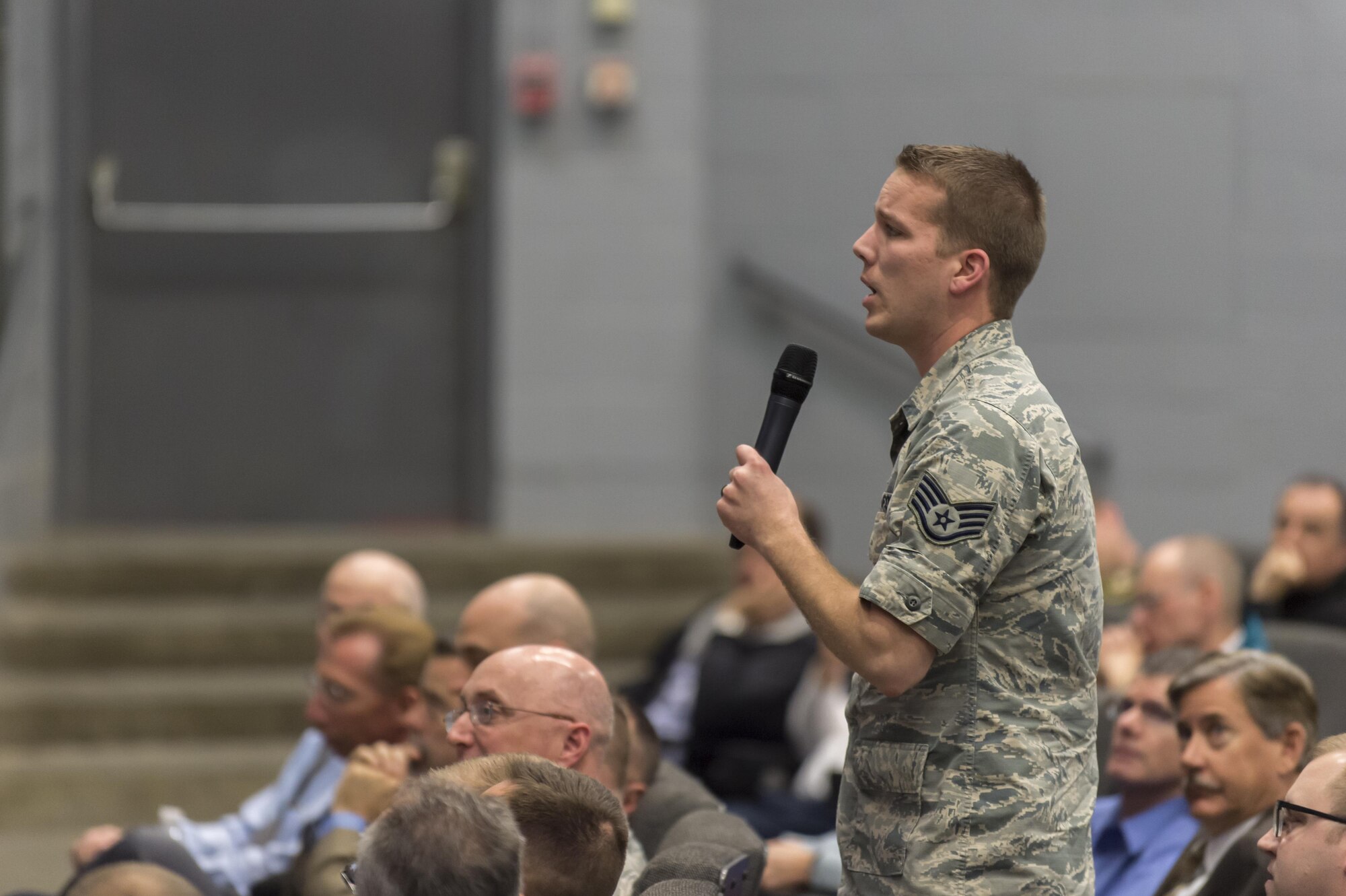 A Team Edwards staff sergeant asks Brig. Gen. Carl Schaefer, 412th Test Wing commander, a question during a commander's call Feb. 1 in the base theater. The session ended with a question and answer period from the audience.  (U.S. Air Force photo by Kyle Larson)