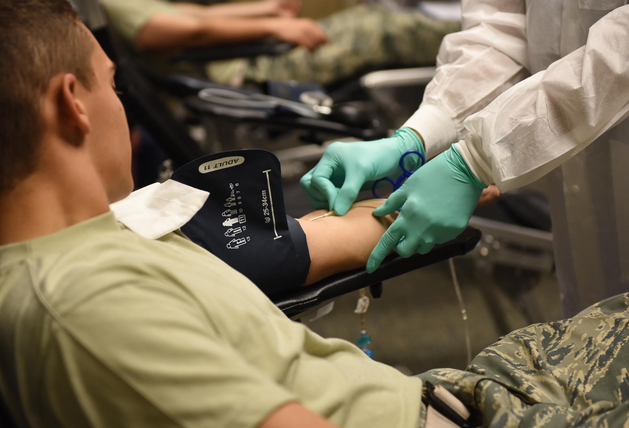 Rhonda McNair, 81st Diagnostic and Therapeutics Squadron phlebotomist, draws blood from Airman Basic Dylan Quinones, 338th Training Squadron student, during a blood drive at Cody Hall Nov. 21, 2016, on Keesler Air Force Base, Miss. The Keesler Blood Donor Center is one of three Air Force blood donor centers and supports the Armed Services Blood Program by collecting blood for the Defense Department for use in deployed locations and military treatment facilities. (U.S. Air Force photo by Senior Airman Holly Mansfield)  