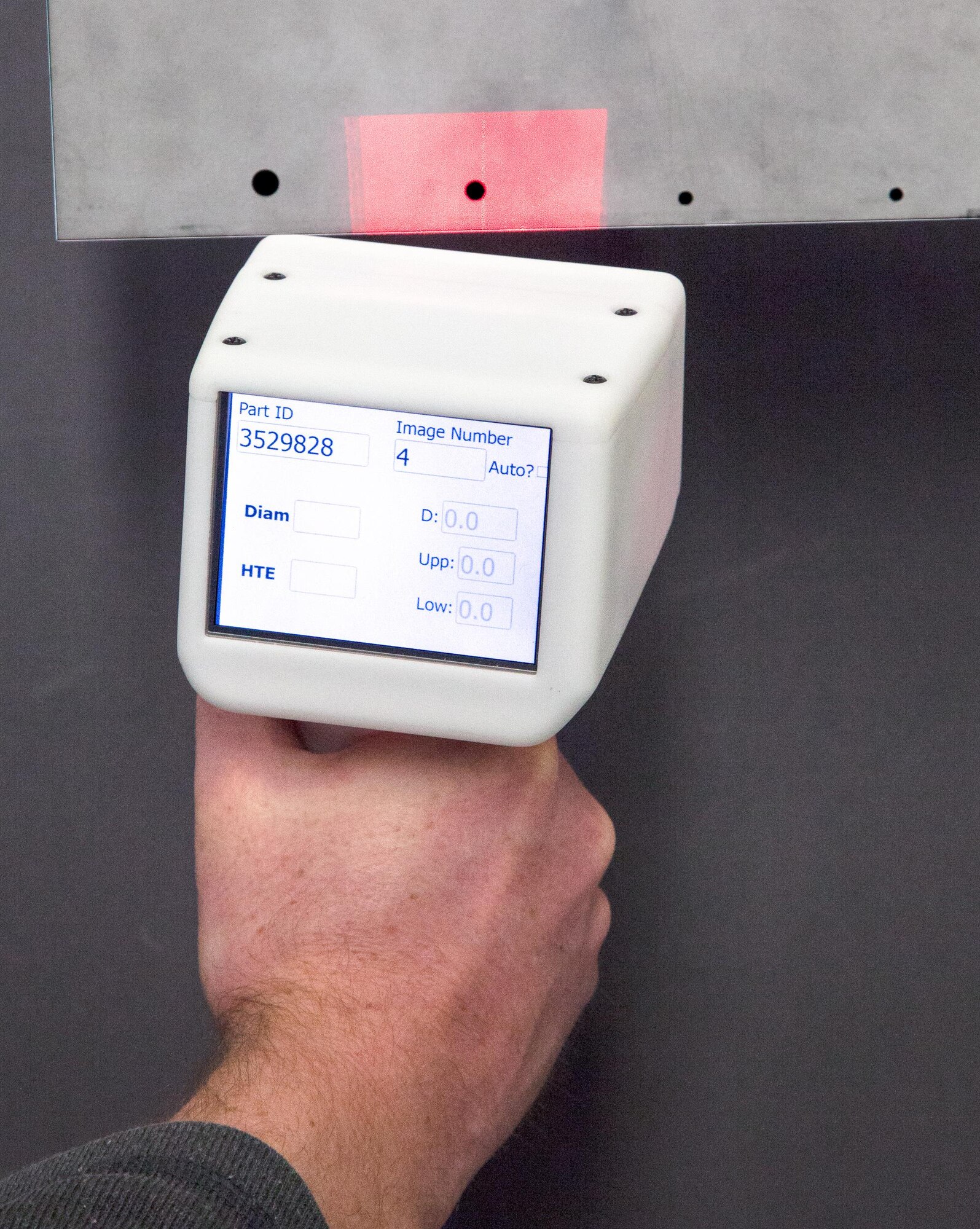 The Hole-to-Edge Measurement Technology system performs a non-contact inspection. The HEMT was developed by Creare, LLC under an Air Force Small Business Innovation Research agreement. The technology and other equipment was temporarily transferred to Creare, LLC under a Cooperative Research and Development Agreement with the Air Force Research Laboratory Materials and Manufacturing Directorate. (Courtesy photo/Creare, LLC)