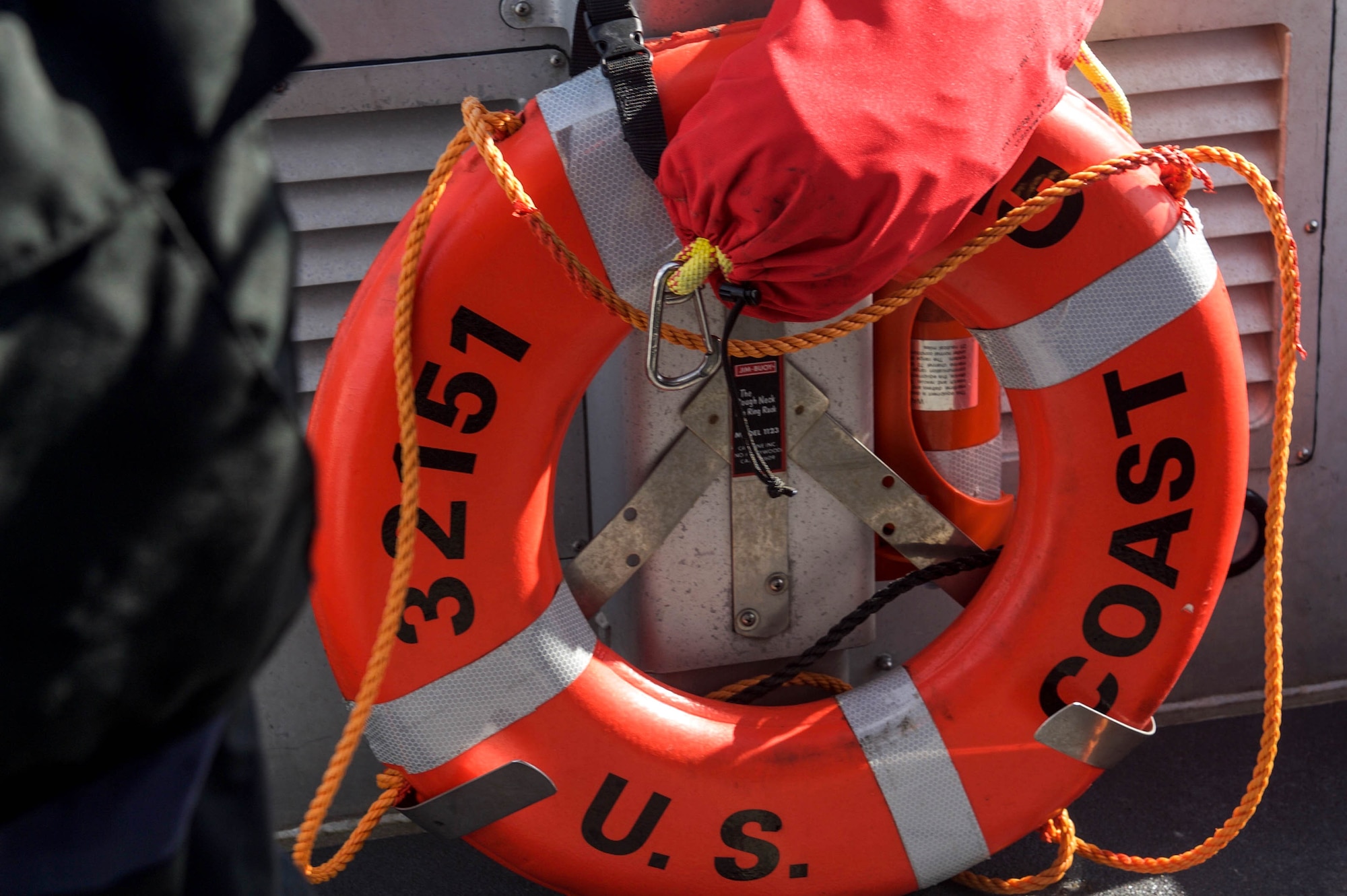 A ring buoy life preservation device is hung on a boat as Port Security Unit 305 prepares for an upcoming deployment by conducting training on maritime operations and land security at Joint Base Langley-Eustis, Va., Feb. 2, 2017. The unit trained on techniques and tactics to deter hostile or unauthorized boats from landing at the shores of JBLE. (U.S. Air Force photo by Airman 1st Class Derek Seifert)