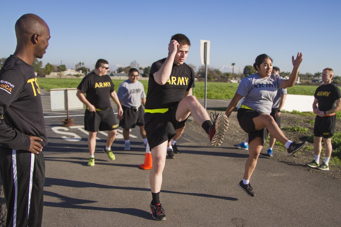 JOINT FORCES TRAINING BASE LOS ALAMITOS, Calif. (January 26, 2017) - Pfc Tylor Estill, 11th Military Police Brigade, and Spc. Devin Cerda, 366th Military Police Company, participate in the Guardian Fit Camp, which taught Army Reserve Soldiers ways to sustain a healthy lifestyle. Soldiers from the Army's World Class Athlete Program also taught different sprint exercises on building leg strength, as well as alternative forms of cardio workouts including various boxing techniques.