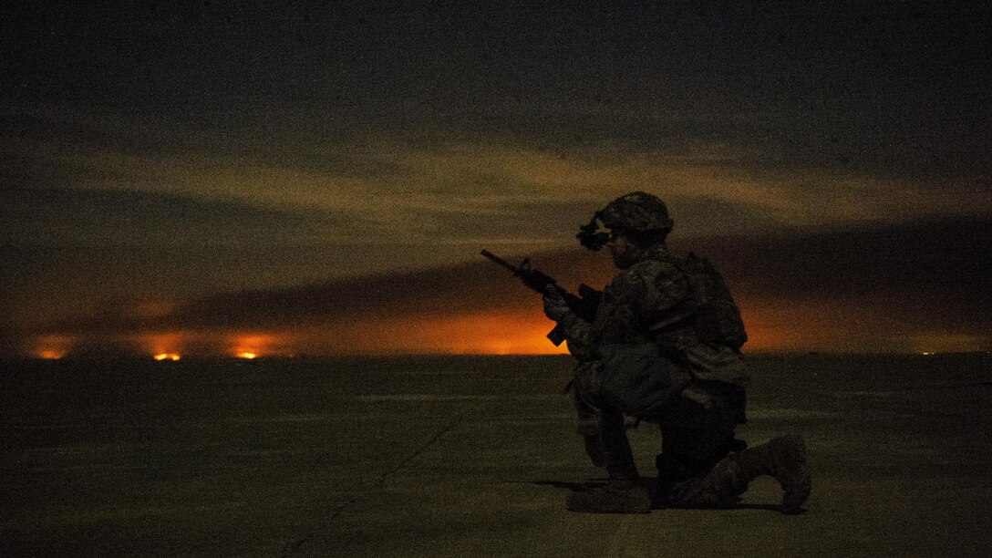 Air Force Senior Airman Henry Nokes secures a section of airfield outside a C-130H Hercules in Qayyarah, Iraq, Feb. 4, 2017. Air Force photo by Senior Airman Jordan Castelan