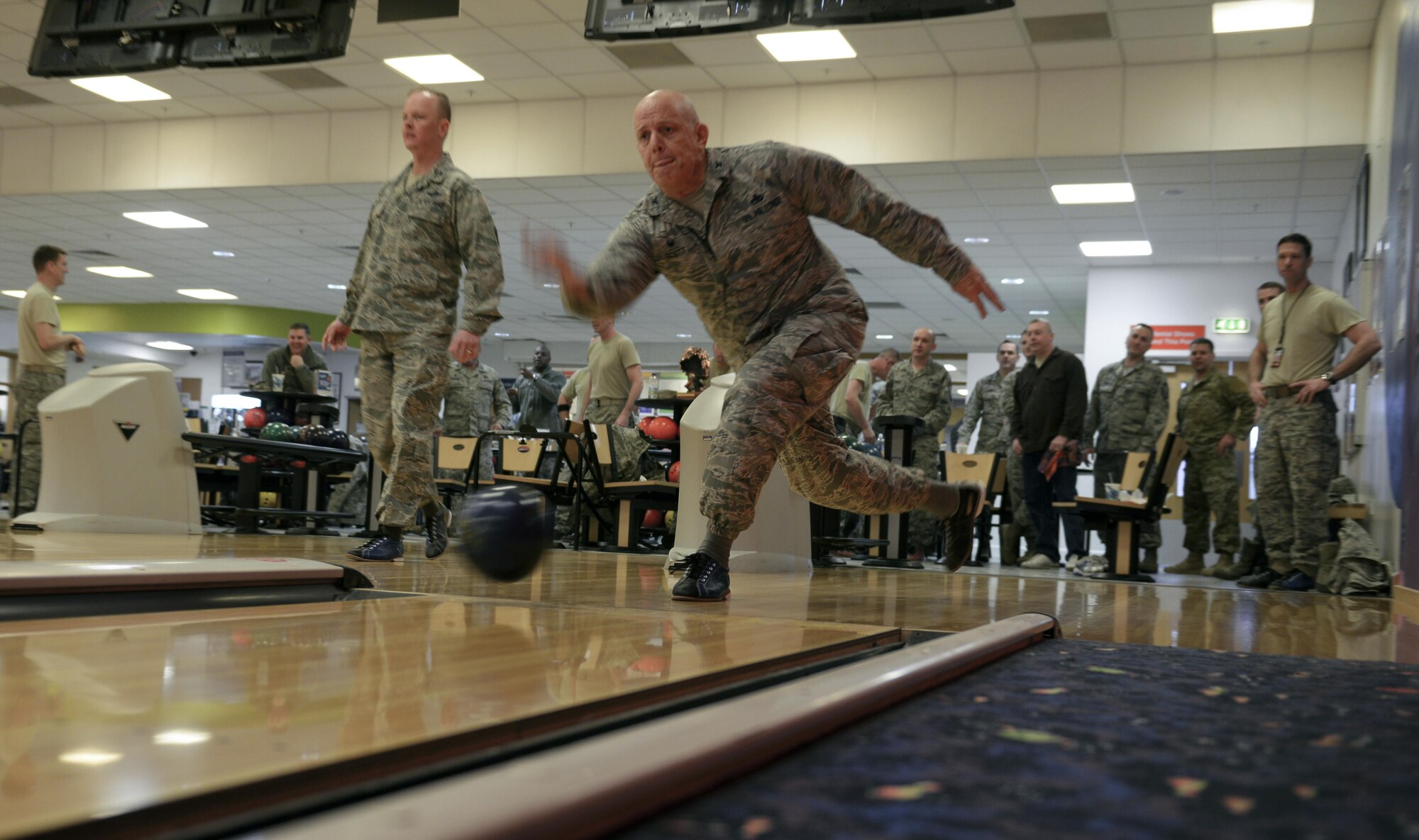 U.S. Air Force Col. Kelly Scott, 100th Maintenance Group commander, bowls during a “Chiefs vs. Eagles” game Feb. 7, 2017, on RAF Mildenhall, England. Team Mildenhall leaders take part in these quarterly events to build camaraderie. (U.S. Air Force photo by Staff Sgt. Micaiah Anthony)
