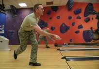 U.S. Air Force Chief Master Sgt. William Taylor, 100th Civil Engineer Squadron fire chief, bowls during a “Chiefs vs. Eagles” game Feb. 7, 2017, on RAF Mildenhall, England. Team Mildenhall leaders played two games of bowling on three lanes. The team with the cumulative highest score from all the lanes and games was deemed the winner. (U.S. Air Force photo by Staff Sgt. Micaiah Anthony)