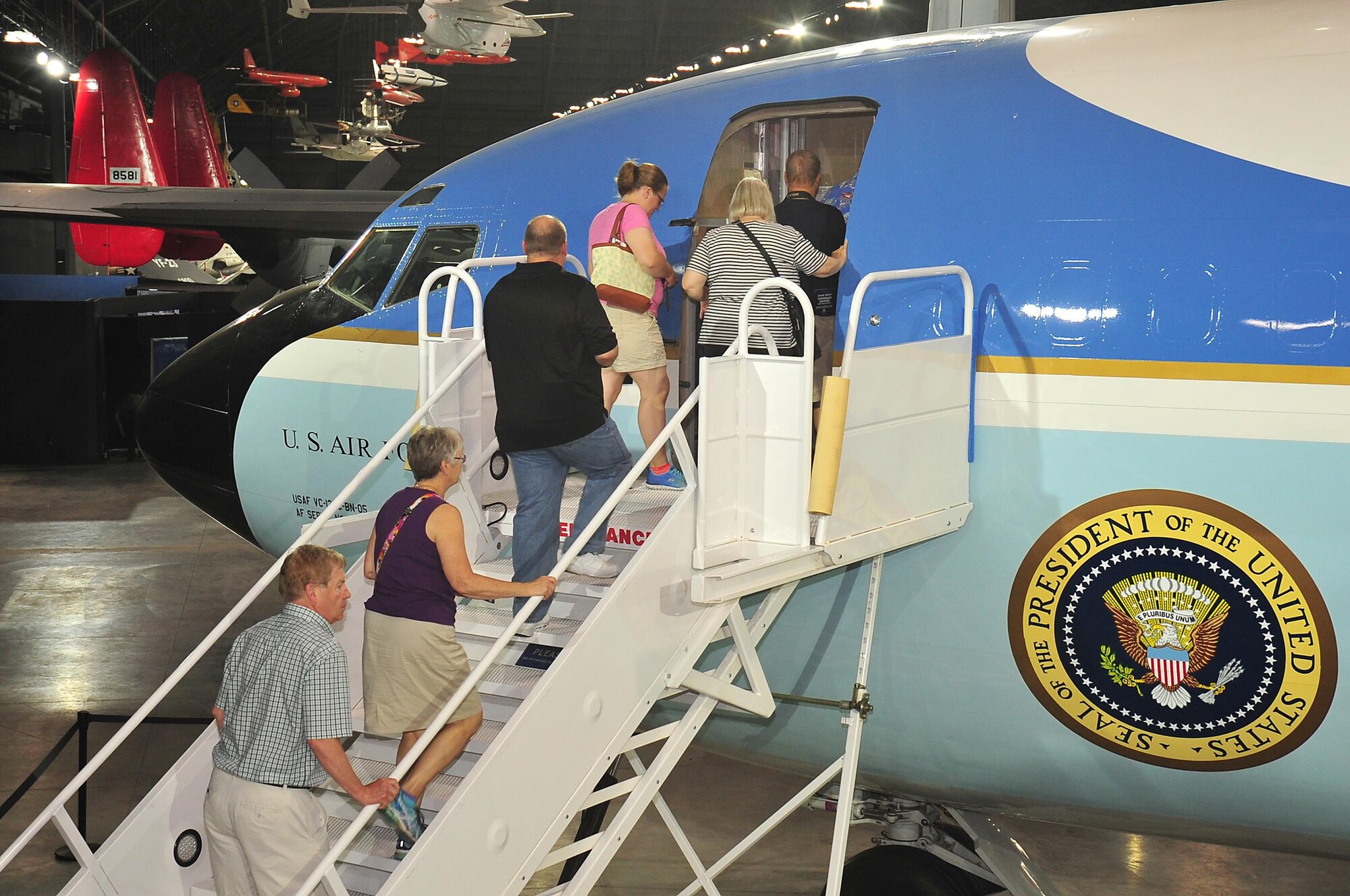 DAYTON, Ohio -- Museum visitors walk up the steps to board the Boeing VC-137C SAM 26000 which is on display in the Presidential Gallery at the National Museum of the United States Air Force. (U.S. Air Force photo by Ken LaRock) 
