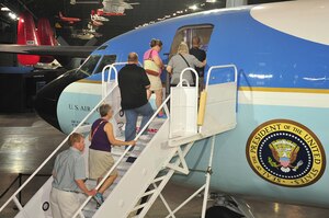 DAYTON, Ohio -- Museum visitors walk up the steps to board the Boeing VC-137C SAM 26000 which is on display in the Presidential Gallery at the National Museum of the United States Air Force. (U.S. Air Force photo by Ken LaRock) 
