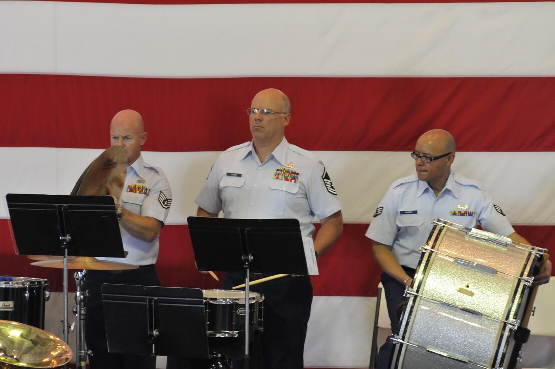 Staff Sgt. Jason Gann, Master Sgt. Eric Odiorne, and Senior Airman Jose Ramirez provide the beat during one of the three concerts performed by the Air National Guard Band of the South onboard the USS Yorktown, anchored in Mt. Pleasant, S.C., July 1, 2014. Covering three states and more than 2,100 miles this year, the band perfected its mission of educating and entertaining military and civilian audiences, performing before more than 5,000 people. U.S. Air National Guard photo by Senior Master Sgt. Paul Mann/Released