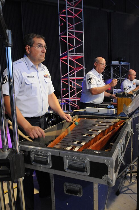 Tech. Sgt. Duane Farnham, Master Sgt. Eric Odiorne and Staff Sgt. Jason Gann play their parts, along with their Air National Guard Band of the South’s fellow members, during the band’s final performance in their Summer Concert Series, July 4, 2014, in Panama City, Fla. During this years' tour the band played in three states, travelled more than 2,100 miles, and entertained an estimated 5,000 people. (U.S. Air National Guard photo by Senior Master Sgt. Paul Mann/Released)