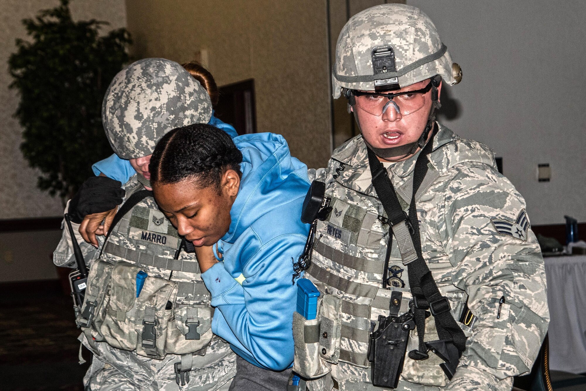 The 375th Security Forces Squadron work with the 375th Medical Group for an active shoort exercise. Medical group teams applied moulage to "victims" before the exercise started and placed them around the Scott Event Center before the exercise started. The exercise helped security forces personnel identify any short falls or limiting factors in respone capabilities and gave them a chance to test and train new tactics and procedues. It also afforded security forces the opportunity to train with the other first responders (fire department and medical) to ensure they can work cohesivley to neutralize the threat, secure the scene and treat victims and casualties as soon as possible. The overall goal is to be prepared to respond efficienty and effectively to minimize the loss of life in the event of an active shooter.(U.S. Air Force photos/Senior Airman Tristin English)