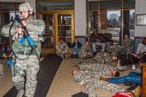 The 375th Security Forces Squadron work with the 375th Medical Group for an active shoort exercise. Medical group teams applied moulage to "victims" before the exercise started and placed them around the Scott Event Center before the exercise started. The exercise helped security forces personnel identify any short falls or limiting factors in respone capabilities and gave them a chance to test and train new tactics and procedues. It also afforded security forces the opportunity to train with the other first responders (fire department and medical) to ensure they can work cohesivley to neutralize the threat, secure the scene and treat victims and casualties as soon as possible. The overall goal is to be prepared to respond efficienty and effectively to minimize the loss of life in the event of an active shooter.(U.S. Air Force photos/Senior Airman Tristin English)