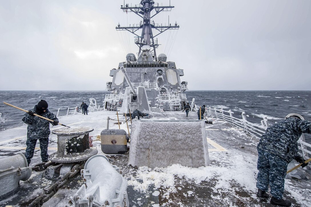 Sailors clear snow and ice from the forecastle of the USS McCampbell in the Sea of Japan, Feb. 3, 2017. The guided-missile cruiser is patrolling in the 7th Fleet area of operations to support security and stability in the Indo-Asia-Pacific region. Navy photo by Petty Officer 2nd Class Jeremy Graham