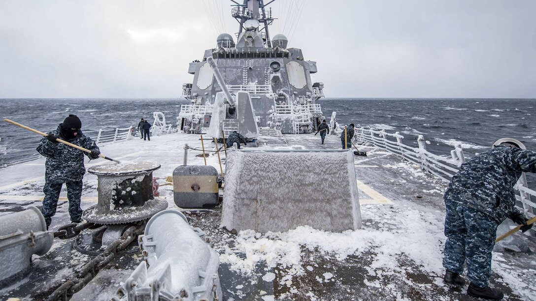 Sailors clear snow and ice from the forecastle of the USS McCampbell in the Sea of Japan, Feb. 3, 2017. The guided-missile cruiser is patrolling in the 7th Fleet area of operations to support security and stability in the Indo-Asia-Pacific region. Navy photo by Petty Officer 2nd Class Jeremy Graham