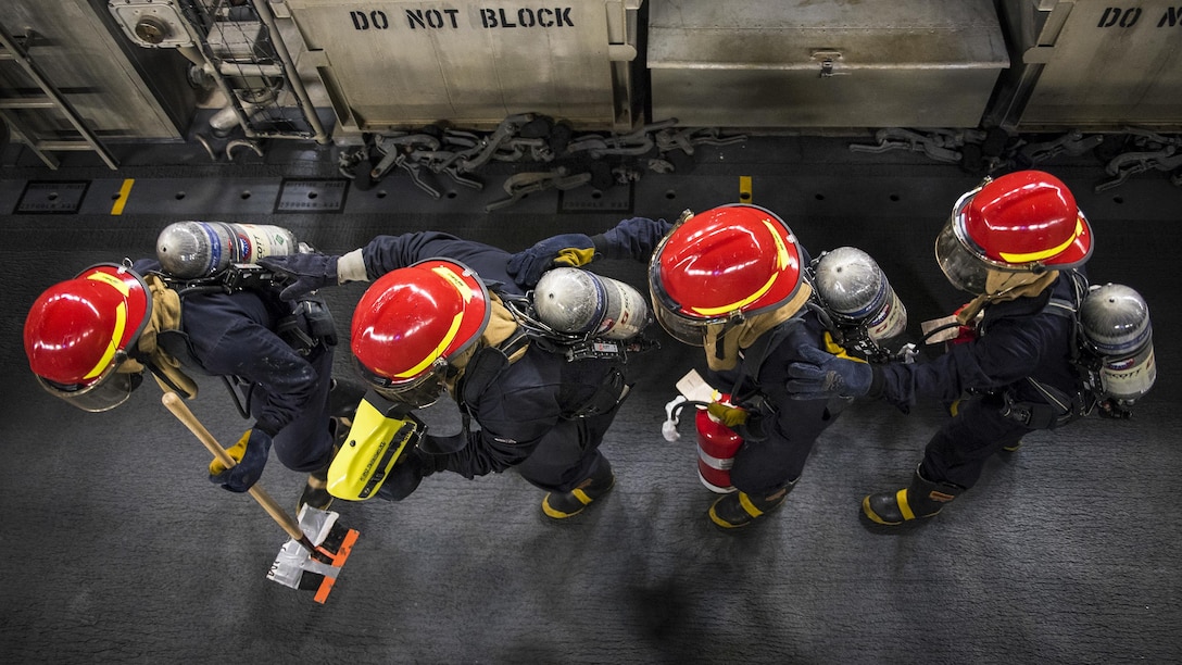 Sailors check the structural integrity of an air-cushion landing craft during a fire drill on the USS Bonhomme Richard in the Philippine Sea, Feb. 8, 2017. The amphibious assault ship is conducting unit-level training to ensure warfighting readiness to prepare for a routine patrol to support security and stability in the Indo-Asia Pacific region. Navy photo by Petty Officer 2nd Class Diana Quinlan