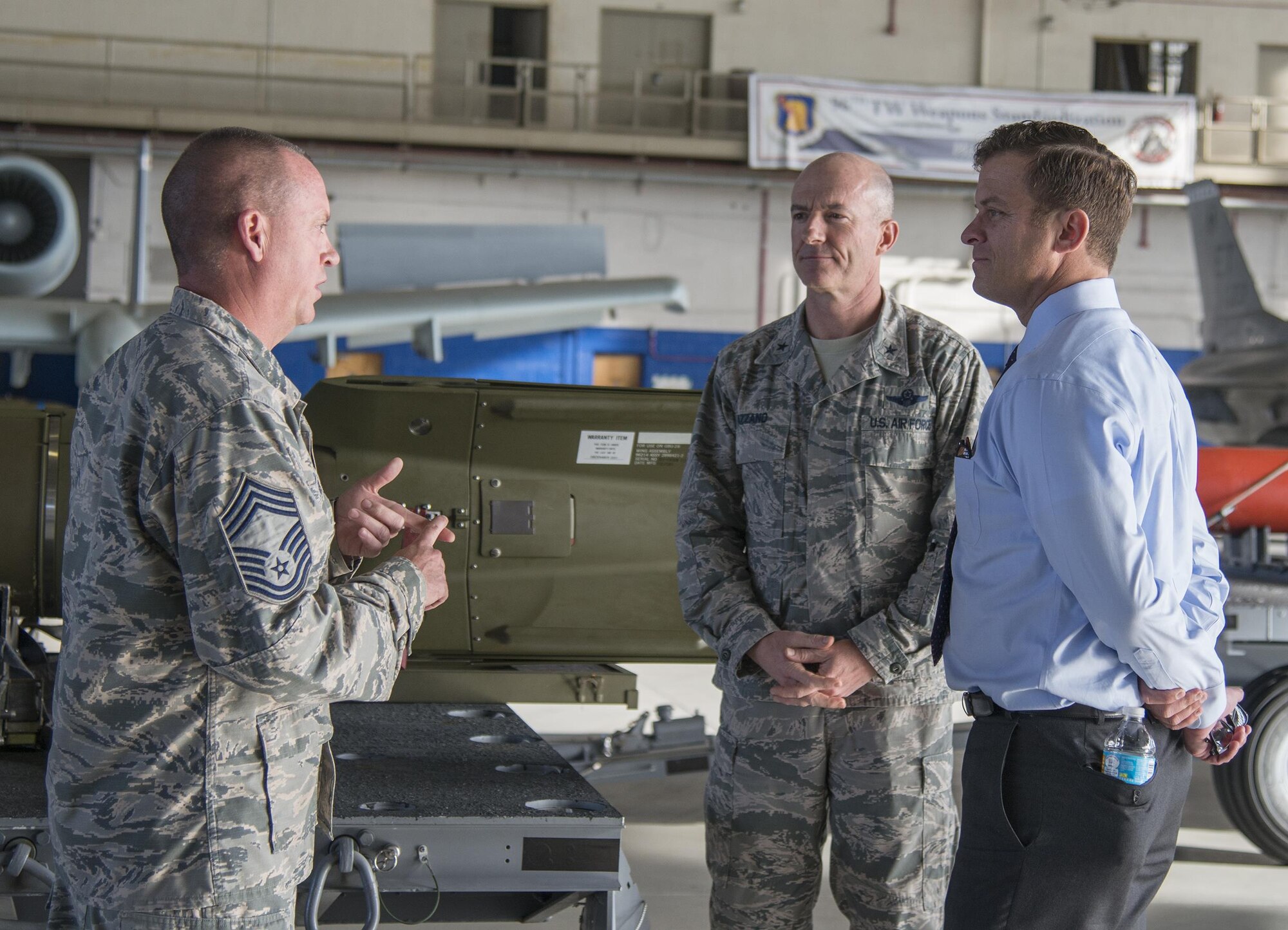 Chief Master Sgt. Todd Folks, 96th Maintenance Group wing weapons manager, explains the maintenance group’s mission to Florida Lieutenant Governor, Carlos Lopez-Cantera, during a King Hanger visit Feb. 6. Lopez-Cantera’s first visit to Eglin Air Force Base, Fla. included an immersion briefing from the 96th Test Wing, Air Force Research Laboratory and the 33rd Fighter Wing. (U.S. Air Force photo/Kristin Stewart)