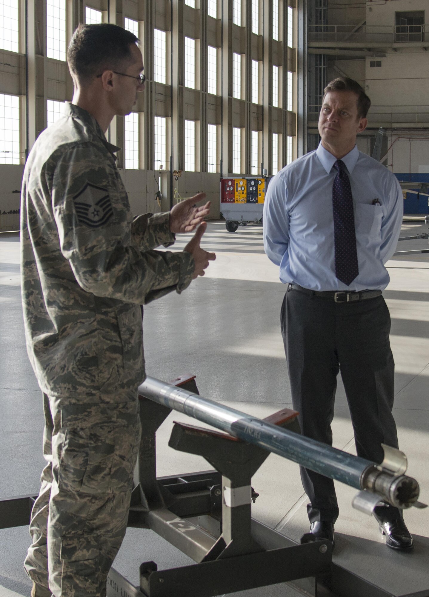 Master Sgt. Nathan Graczyk, 96th Maintenance Group load standardization crew chief, briefs the capabilities of the Advance Precision Kill Weapons System munition to Lieutenant Governor, Carlos Lopez-Cantera, during a King Hanger visit here Feb. 6. The load and lead standardization crews train and evaluate Airmen to safely load and unload aircraft munitions. (U.S. Air Force photo/Kristin Stewart)