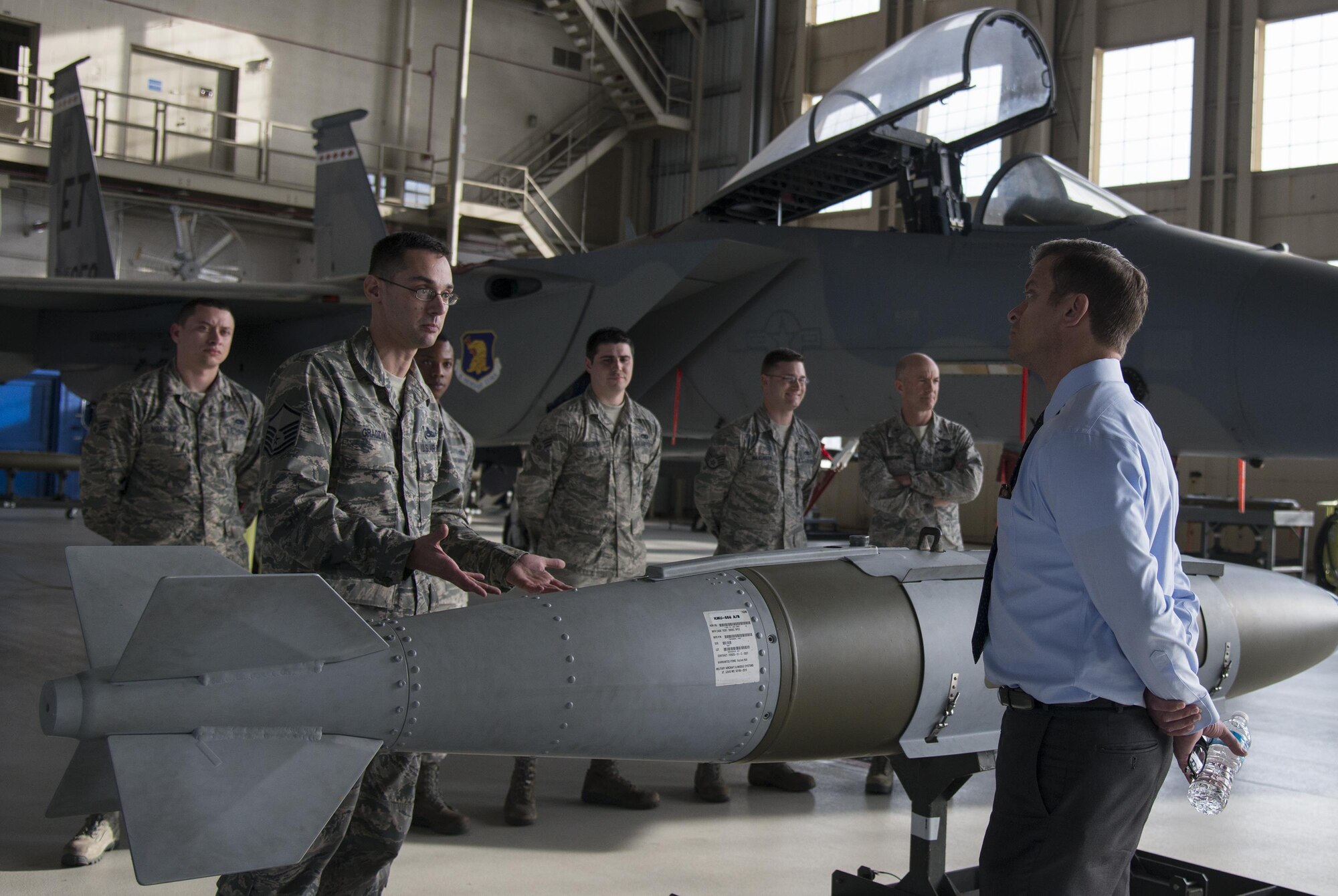 Master Sgt. Nathan Graczyk, 96th Maintenance Group load standardization crew chief, briefs the capabilities of the GPS-guided Joint Direct Attack Munition to Lieutenant Governor, Carlos Lopez-Cantera, during a King Hanger visit here Feb. 6. The load and lead standardization crews train and evaluate Airmen to safely load and unload aircraft munitions. (U.S. Air Force photo/Kristin Stewart)