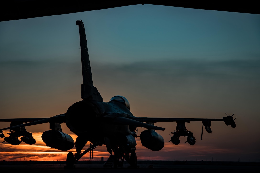 An F-16 Fighting Falcon sits on the flightline at sunset at an undisclosed location in Southwest Asia, Feb. 4, 2017. The F-16 is part of the 134th Expeditionary Fighter Squadron, supporting Operation Inherent Resolve in the fight against the Islamic State of Iraq and the Levant. Air Force photo by Master Sgt. Benjamin Wilson