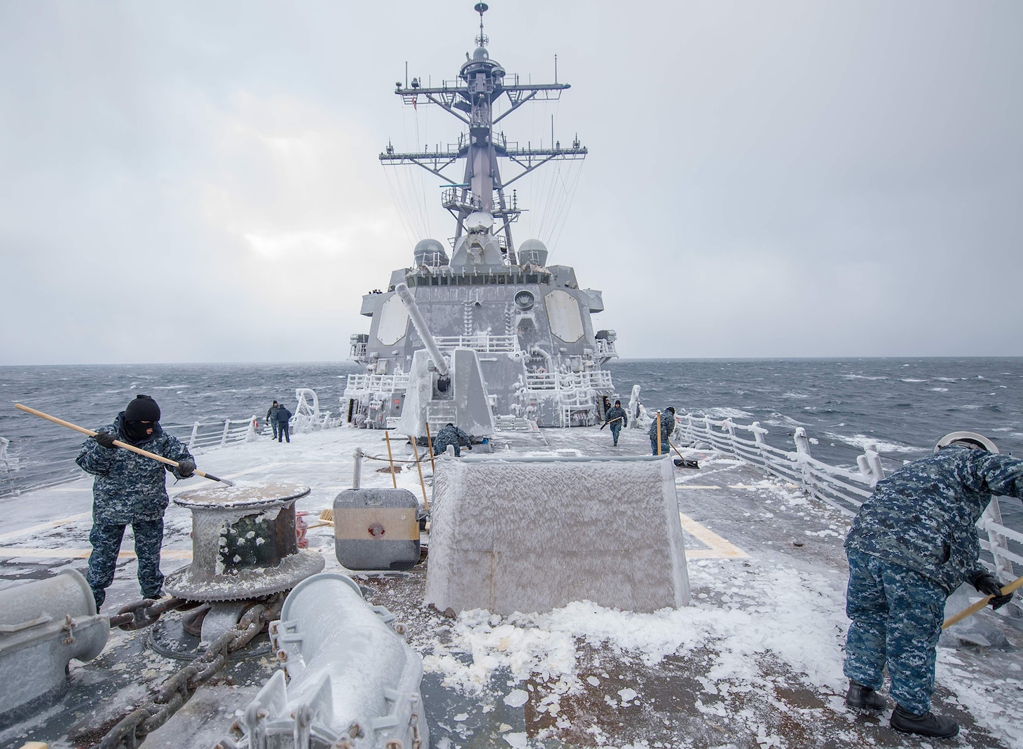 Sailors assigned to the forward-deployed Arleigh Burke-class guided-missile destroyer USS McCampbell (DDG 85) clear the ship’s forecastle of snow and ice, Feb. 3, 2017. McCampbell is on patrol in the 7th Fleet area of operations in support of security and stability in the Indo-Asia-Pacific region.