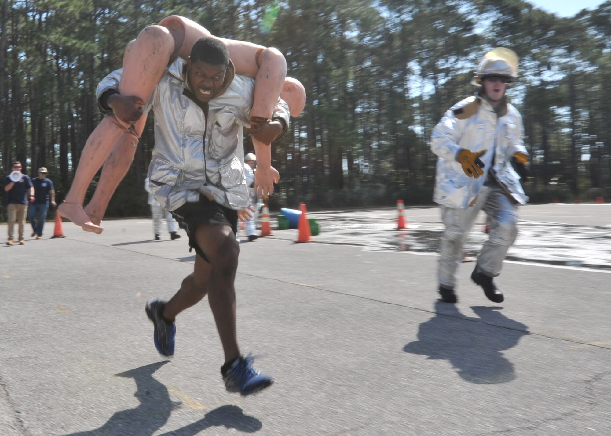 U.S. Air Force Staff Sgt. Antonio Johnson, 325th Security Forces Squadron S-4 mobility NCOIC, carries a training dummy during the Combat Challenge Comprehensive Airman Fitness day on Feb. 3, 2017. Airmen from various different squadrons and members from the Rutherford High School Junior Reserve Officer Training Corps competed in the event which tested their strength, stamina and teamwork skills. (U.S. Air Force photo by Senior Airman Ty-Rico Lea/Released)