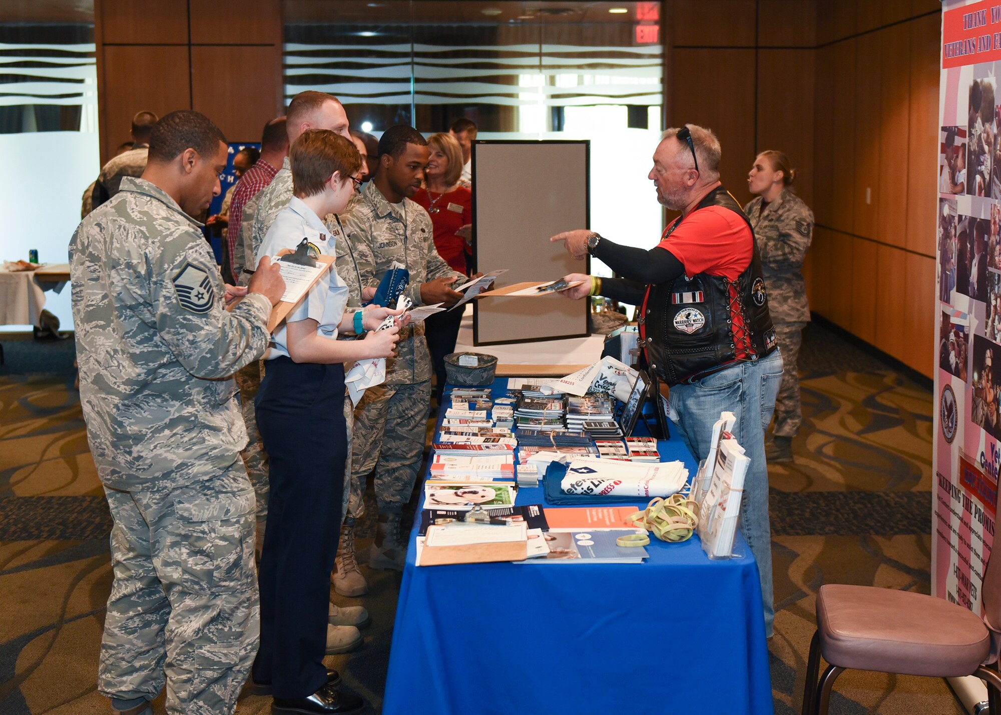 Team Tyndall Airmen and Junior ROTC cadets from Rutherford High School receive information from a veterans support organization at the professional organization exhibition at the Horizons Community Center during Tyndall’s Comprehensive Airman Fitness day, Feb. 3, 2017. The exhibition showcased multiple professional development organizations and support agencies in the Panama City area. (U.S. Air Force photo by Senior Airman Dustin Mullen/Released)