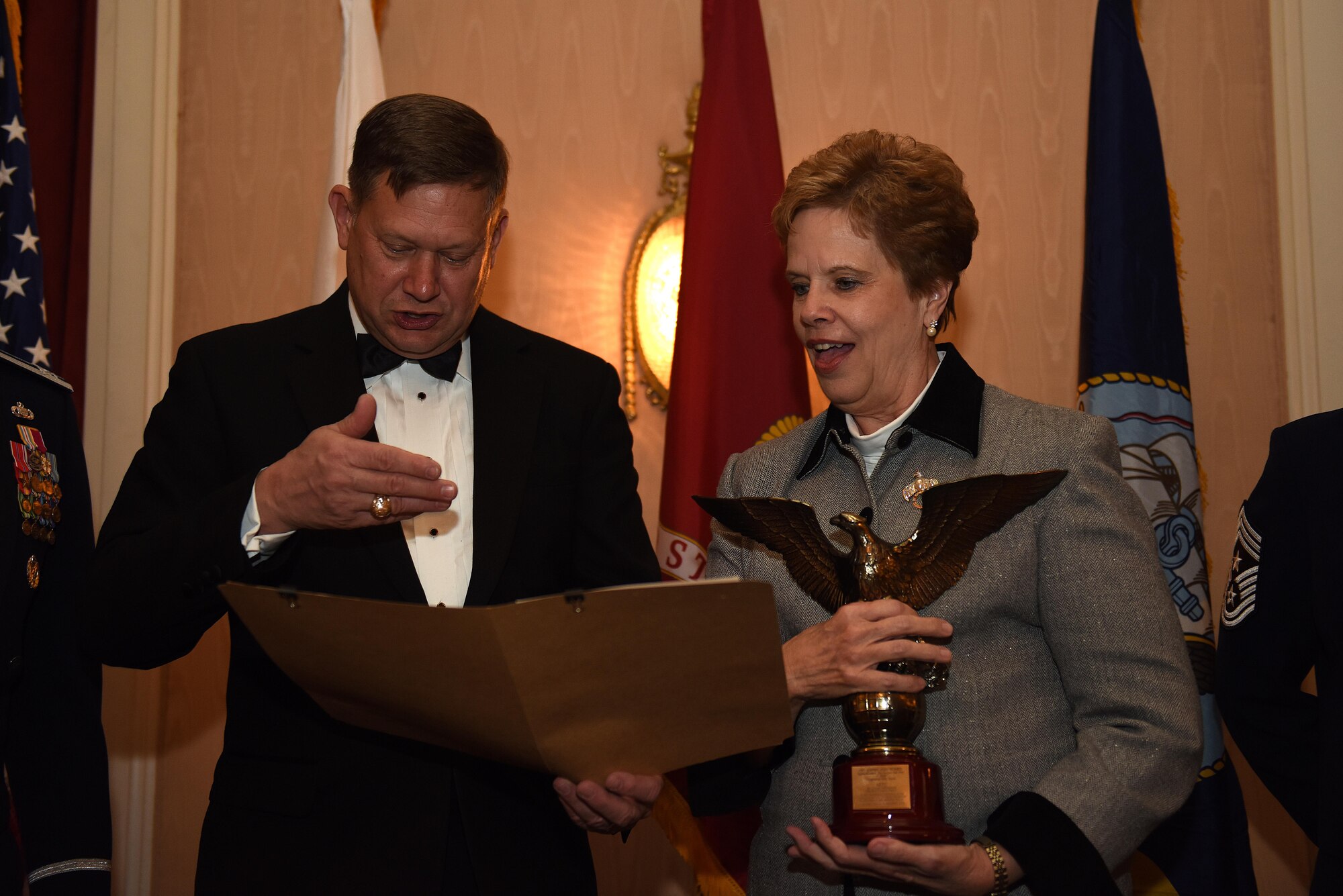 George Gagnon, Air Education and Training Command International Training and Education director, reads the award information for the Dr. Carol Bonds’ International Student Support Award at the Goodfellow Air Force Base Annual Awards in the Cactus Hotel in San Angelo, Texas, Feb. 3, 2017. This award is presented to a person whose long-term volunteer efforts have significantly and positively helped international students at AETC schools adjust to life in the U.S. and succeed in their academic endeavors. (U.S. Air Force photo by Airman 1st Class Caelynn Ferguson/Released)