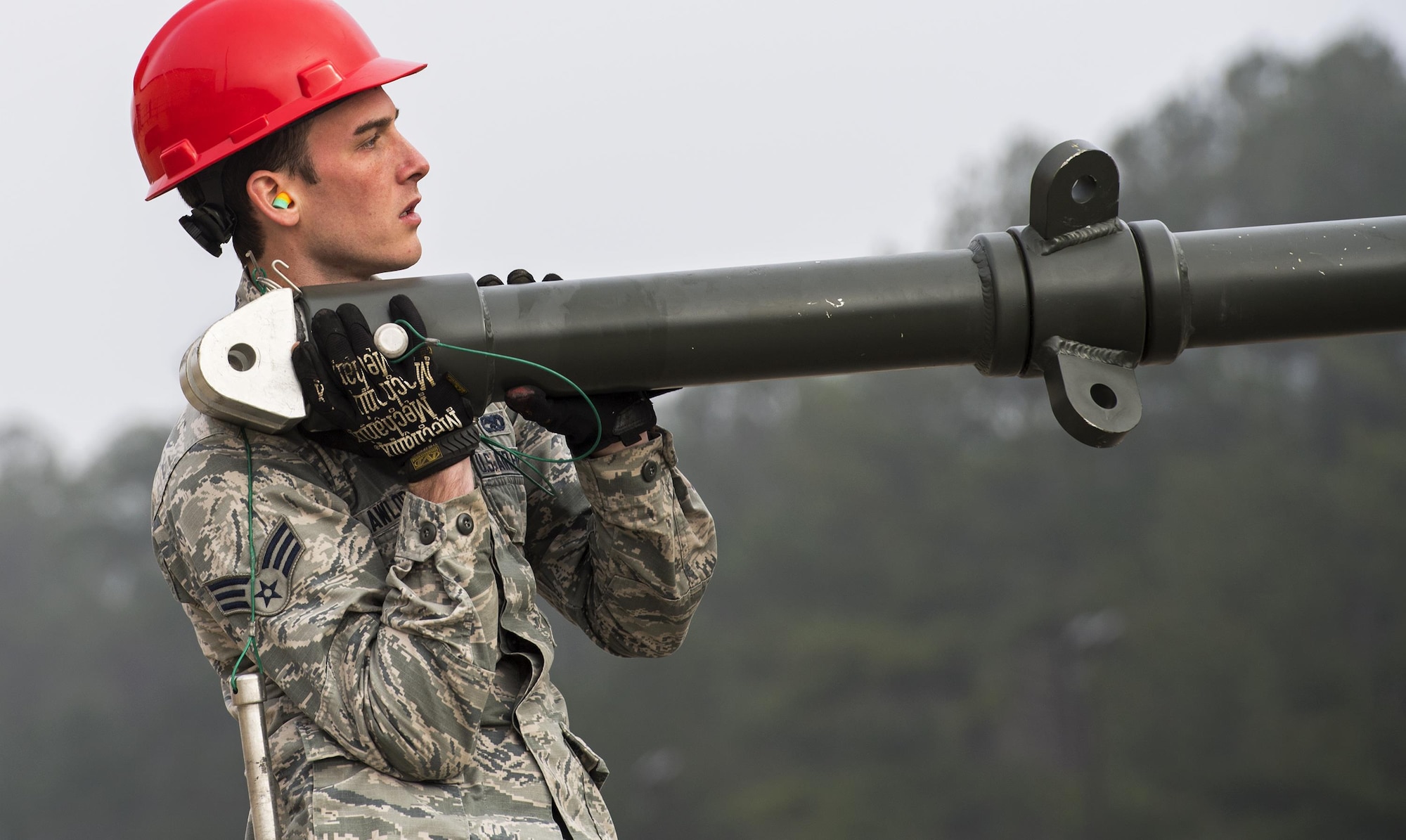 Senior Airman Jeremiah Lawlor, 23d Equipment Maintenance Squadron conventional maintenance crew chief, builds a Munitions Assembly Conveyer, Feb. 3, 2017, at Moody Air Force Base, Ga. A MAC is a conveyer belt ammo Airmen use while they build bombs. (U.S. Air Force Photo by Airman 1st Class Janiqua P. Robinson)