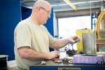 Master Sgt. Tony Frye, 403rd Fabrication Flight metals technology craftsman, adjusts a mocrometer Feb. 1 at Keesler Air Force Base. (U.S. Air Force photo/Staff Sgt. Heather Heiney)