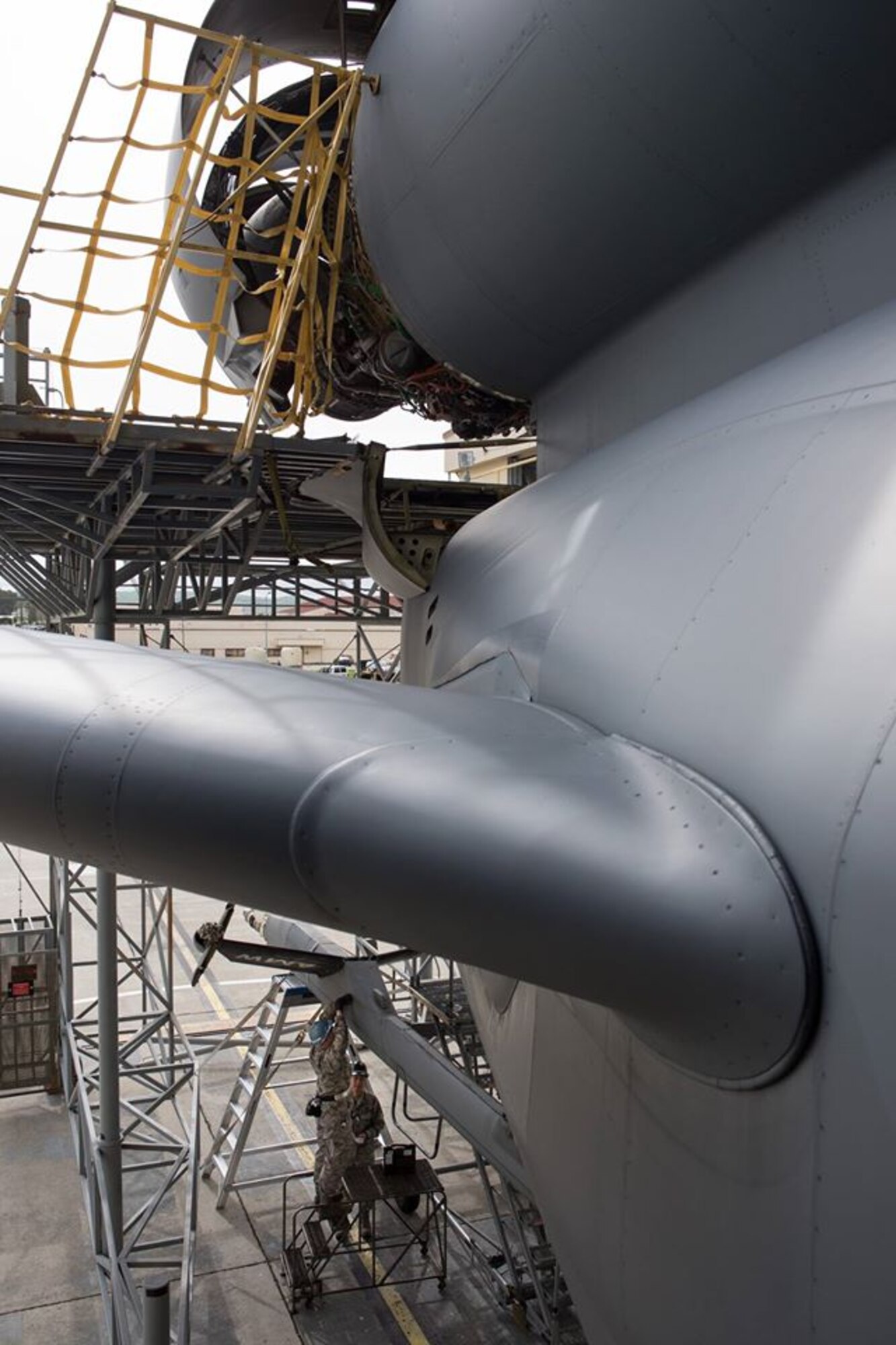 Air Force Staff Sgts. Charles Womack and Brandon Nicolas, 349th Maintenance Squadron crew chiefs, replace a panel on the boom of a KC-10 Extender at Travis Air Force Base, Calif., on Feb. 7, 2017. This week, the reservists are working alongside hundreds of their fellow Citizen Airmen from the 349th Maintenance Group to support Wrench Week 2017. The event offers opportunities for reservists to accomplish ancillary training, upgrade training and gain practical experience necessary to sharpen their primary job skills. (U.S. Air Force photo/Ken Wright)