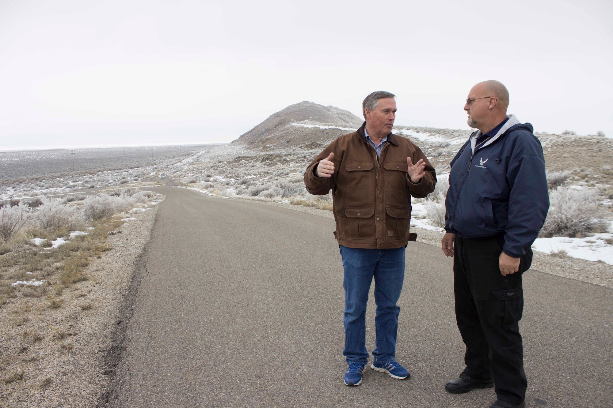 Hal Sager (left), 75th Range Maintenance engineer at the Utah Test and Training Range at Hill Air Force Base, Utah, discusses the scope of snow operations with Preston Benedyk, AFCEC vehicle and snow control manager. Benedyk recently visited base engineers at the range to discuss Air Force snow removal methods being used at Hill Air Force Base. The base operation space equates to one fourth the size of the state of Utah. (U.S. Air Force Photo/Susan Lawson)
