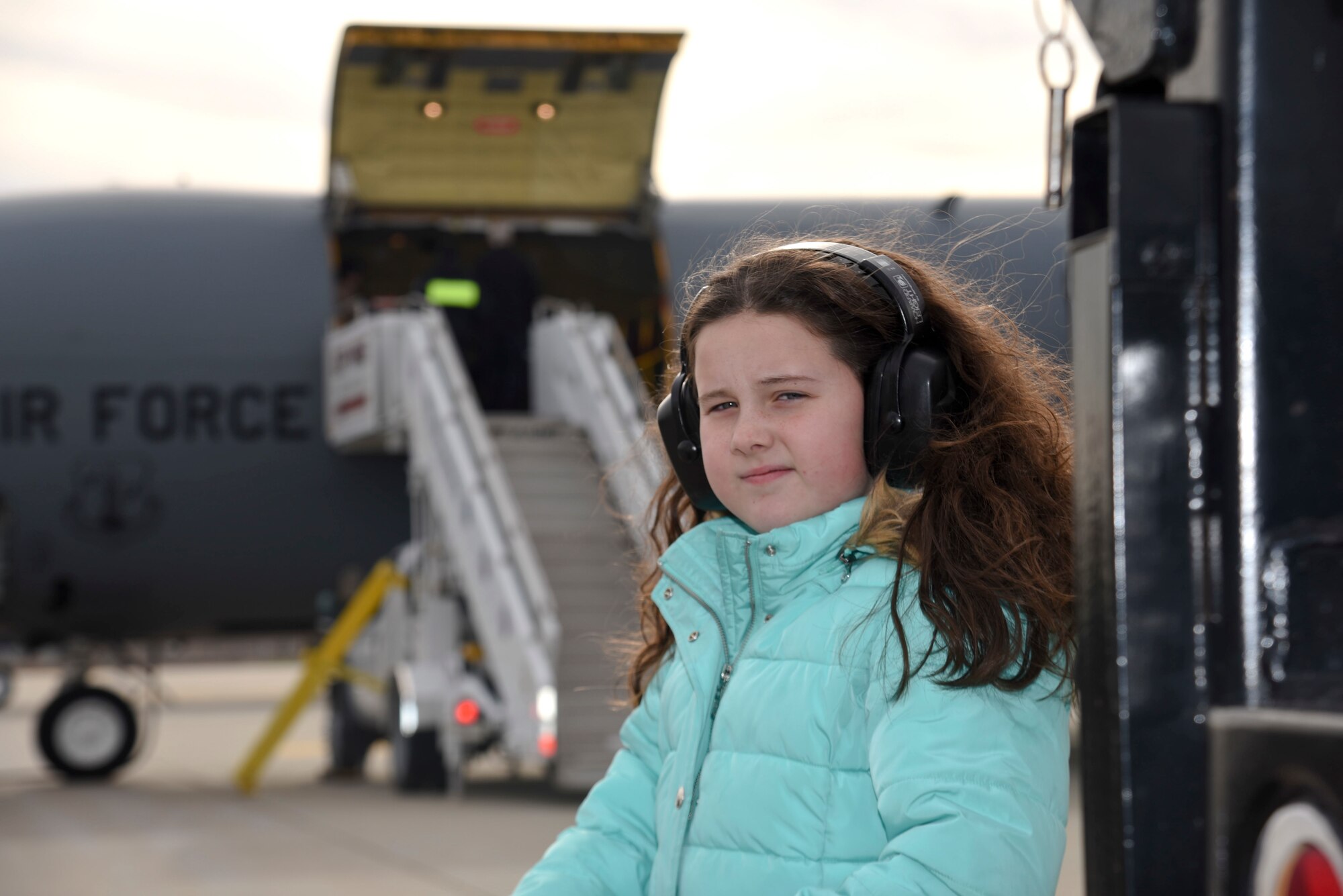 Emma Balas waits to greet, SSgt Jason Balas an 108th Wing Crew Chief, at Joint Base McGuire-Dix-Lakehurst, N.J., Dec. 21, 2016. SSgt Balas and 25 other New Jersey Air National Guard 108th Airmen, completed the last leg of their return trip after leaving more than two months ago. (U.S. Air National Guard photo by Staff Sgt. Ross A. Whitley/Released)