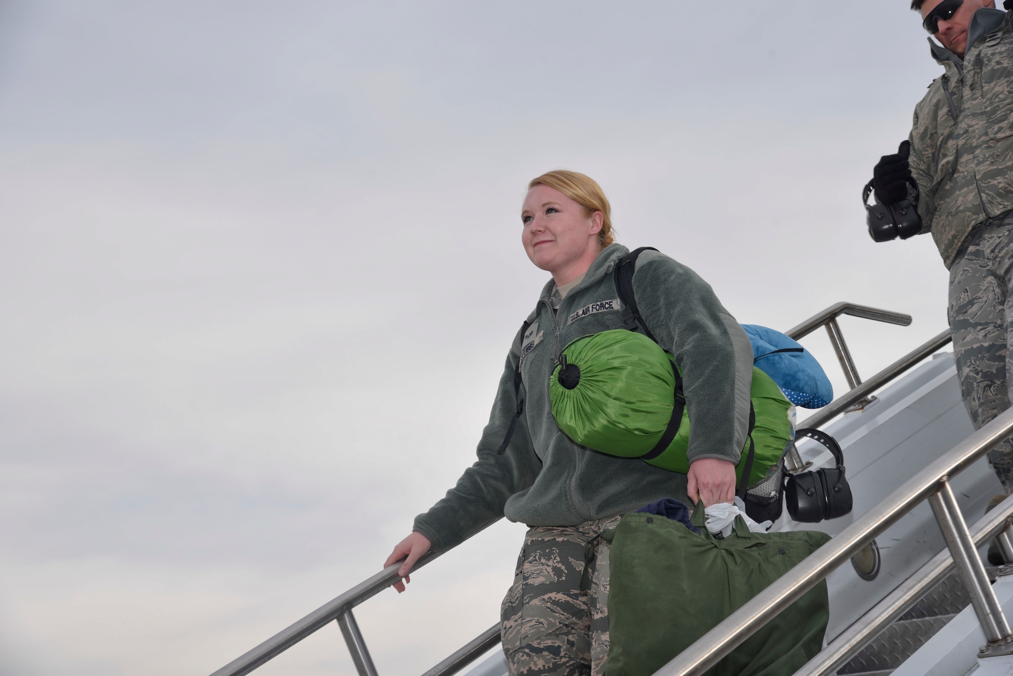 Senior Airmen Rachel Stubbs, Fuel Systems Apprentice from the 108th Wing, New Jersey Air National Guard, searches the crowd for familiar faces at Joint Base McGuire-Dix-Lakehurst, N.J., Dec. 21, 2016, as she returns from supporting operation inherent resolve. (U.S. Air National Guard photo by Staff Sgt. Ross A. Whitley/Released)