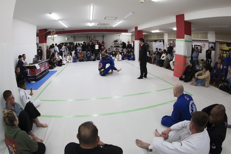 U.S. Marines form Marine Corps Air Station Iwakuni watch Japanese locals compete during the Duamau Tournament, a jiu jitsu competition at the TK Training Center in Hiroshima, Japan, Feb. 5, 2017.  Jiu jitsu is an art of weaponless fighting which employs holds and throws to subdue or disable an opponent. The Marines displayed their hard work and dedication through competition in their respective weight classes against Japanese locals. (U.S. Marine Corps photo by Lance Cpl. Joseph Abrego)