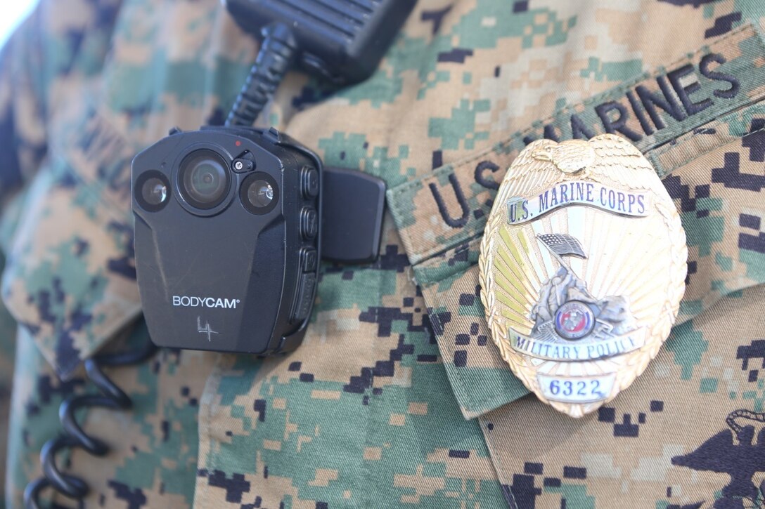 A Marine with the Provost Marshal Office aboard Marine Corps Air Station Miramar, Calif., wears a new ‘bodycam’ system, Feb. 2.  Officers can use the camera to record video as evidence, enabling officials to review it later for both investigative and training purposes. (U.S. Marine Corps photo by Cpl. Harley Robinson/Released)