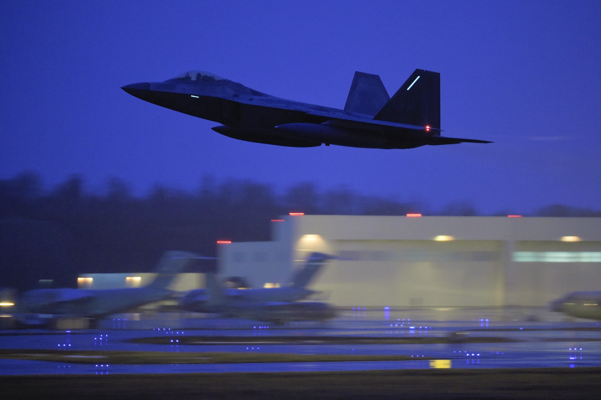 A U.S. Air Force F-22 Raptor assigned to the 90th Fighter Squadron takes off from Joint Base Elmendorf-Richardson, Alaska, March 28, 2016. At the direction of U.S. Navy Adm. Harry Harris Jr., U.S. Pacific Command commander, Pacific Air Forces will send 12 F-22 Raptor aircraft and approximately 190 Airmen to Royal Australian Air Force Base Tindal in early February to conduct combined exercises and training missions with the Royal Australian Air Forces as part of the Enhanced Air Cooperation Initiative under the Force Posture Agreement between the United States and Australia.  (U.S. Air Force photo by Alejandro Pena/Released)