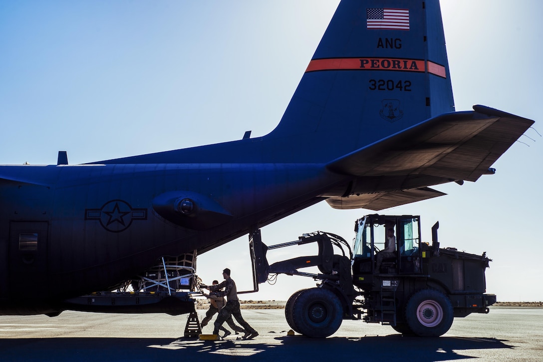 Air Force Staff Sgt. Nick Barth pushes cargo inside a C-130H Hercules before takeoff from Southeast Asia, Feb. 4, 2017. Barth, a 737th Expeditionary Airlift Squadron loadmaster, was part of a team that delivered thousands of pounds in supplies to aid in the fight against the Islamic State of Iraq and the Levant and retake Mosul. Air Force photo by Senior Airman Jordan Castelan