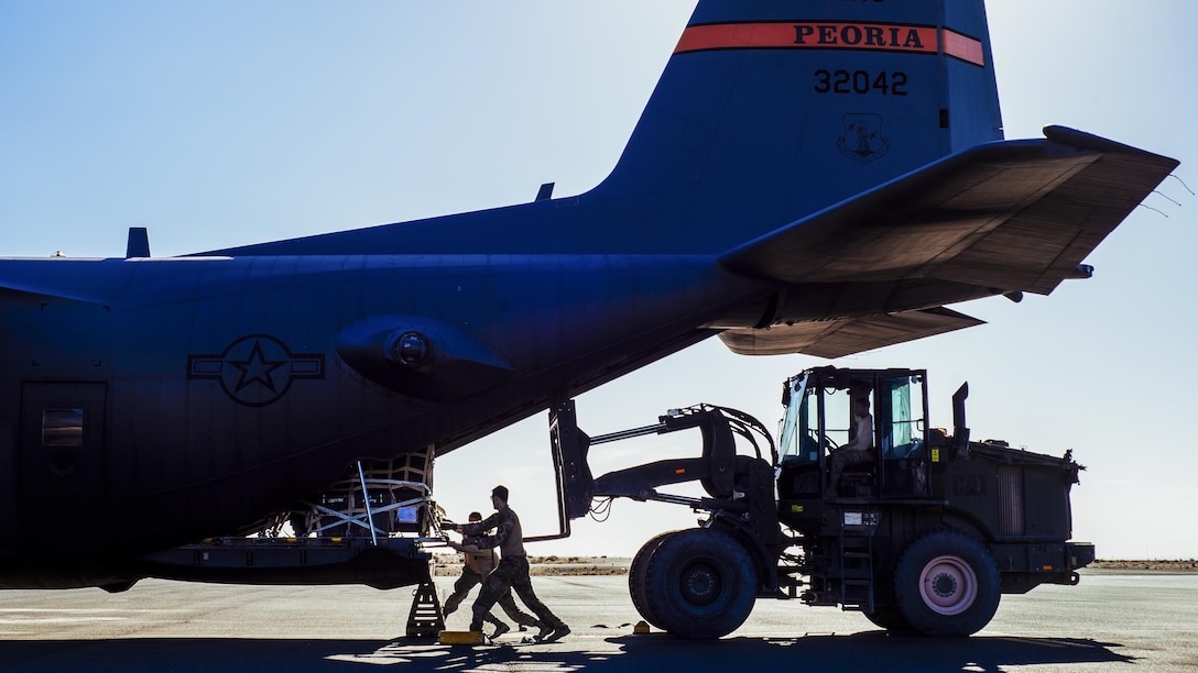 Air Force Staff Sgt. Nick Barth pushes cargo inside a C-130H Hercules before takeoff from Southeast Asia, Feb. 4, 2017. Barth, a 737th Expeditionary Airlift Squadron loadmaster, was part of a team that delivered thousands of pounds in supplies to aid in the fight against the Islamic State of Iraq and the Levant and retake Mosul. Air Force photo by Senior Airman Jordan Castelan