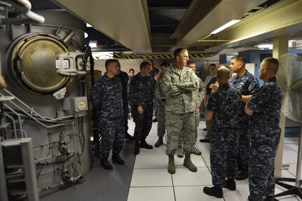 U.S. Navy Capt. Steve Hall (second from right), commanding officer of Trident Training Facility (TTF) Kings Bay, gives U.S. Air Force Gen. John E. Hyten (center), commander of U.S. Strategic Command ( a tour of a submarine missile technician training lab at Naval Submarine Base Kings Bay, Ga., during a force familiarization trip, Feb. 1, 2017.  The visit, Hyten’s first as commander of USSTRATCOM, allowed him to observe his combat ready forces at Naval Station Norfolk, Va.; Naval Submarine Base Kings Bay, Ga.; Barksdale Air Force Base, La.; and at sea. One of nine DoD unified combatant commands, USSTRATCOM has global strategic missions assigned through the Unified Command Plan that include strategic deterrence; space operations; cyberspace operations; joint electronic warfare; global strike; missile defense; intelligence, surveillance and reconnaissance; and analysis and targeting. (