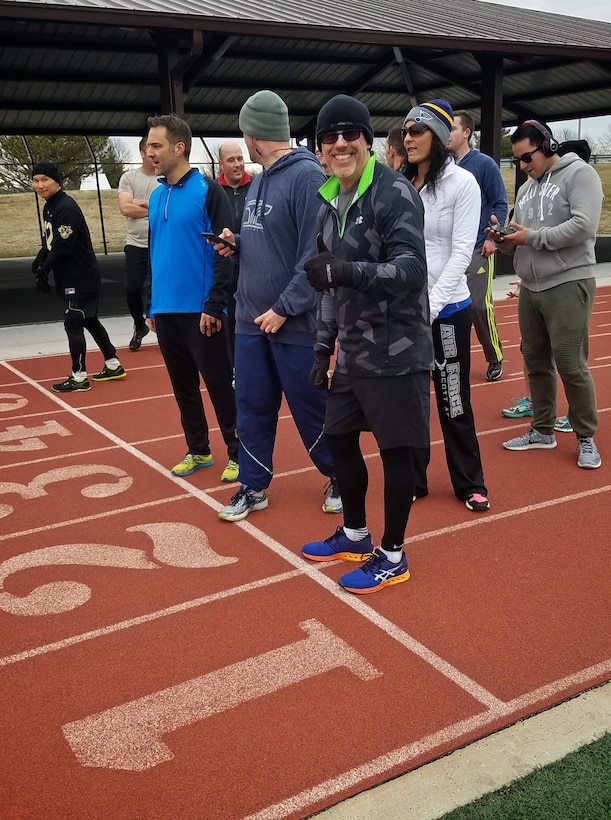 Christopher Parr, 932nd Airlift Wing Public Affairs specialist, is thumbs up as he starts the first 400m sprint during the Scott Health Promotion running clinic, Feb. 1, 2017, Scott Air Force Base, Illinois. You can follow along as Parr documents his journey to becoming a better runner in the commentaries section of the 932nd AW website.  (U.S. Air Force photo by Christopher Parr)